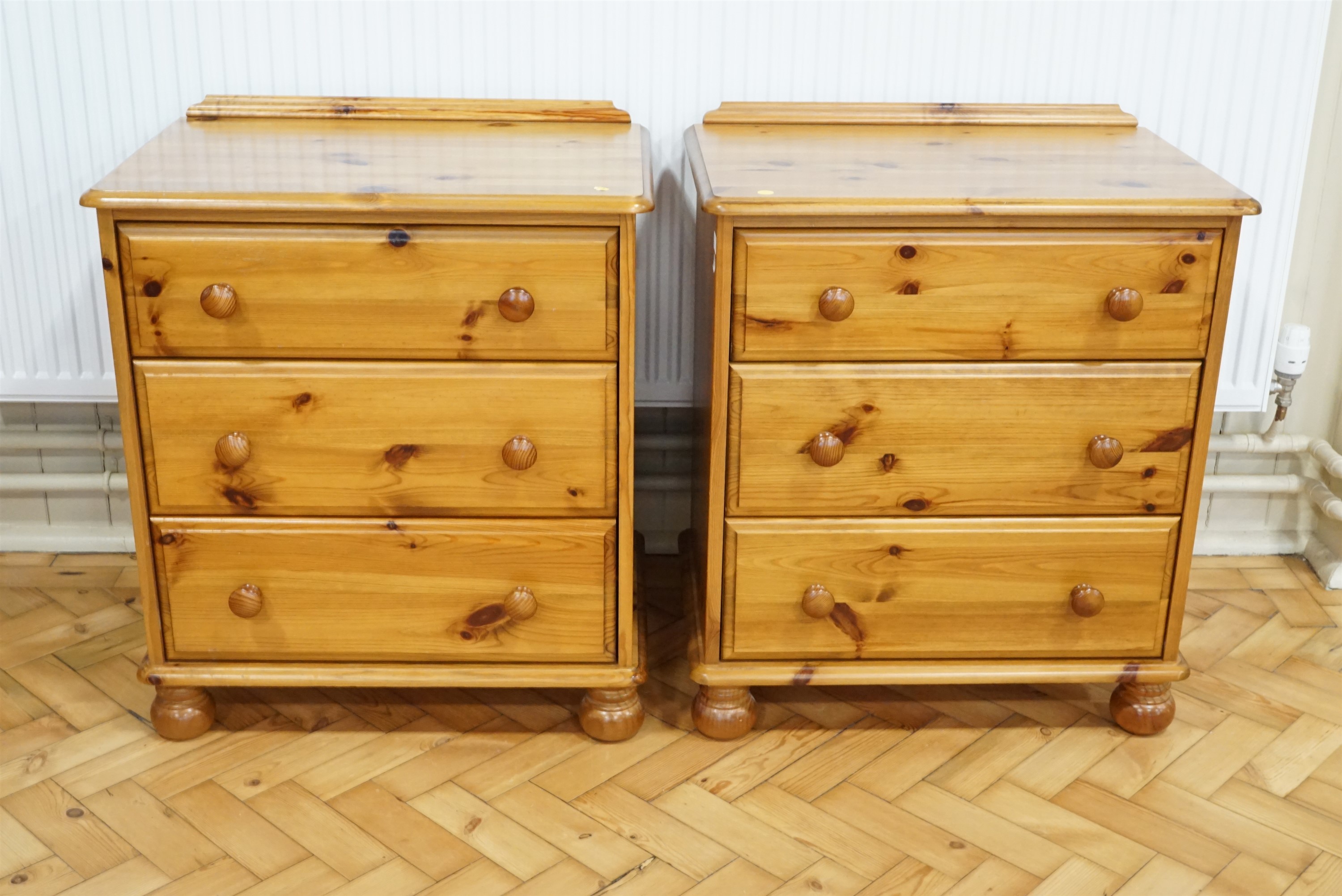 A pair of late 20th Century pine three-drawer bedside or similar chests, 67 cm x 46 cm x 77 cm high