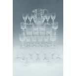 A set of five crystal wine glasses, together with six whisky tumblers, water jug etc