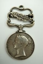A Crimea Medal with Sebastopol clasp engraved to Pte R Brown, 12th Lancers