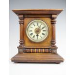 A German Walnut mantle clock, 26 cm x 16 cm x 27 cm,(running when catalogued),accuracy and