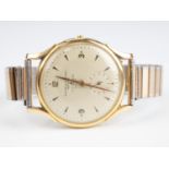 A 1950s Baume and Mercier 18 ct gold wristwatch, having a 17 jewel movement, a silvered dial with