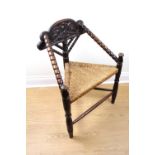 A late 19th early 20th Century turner's chair with rush seat, 88 cm x 45 cm x 65 cm
