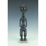 An African tribal carved female figure, Luba people, Congo, mounted on perspex platform base, 39 cm