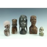 Five various African carved stone and wood busts, tallest 20 cm