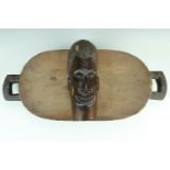 An African ethnic two handled carved zoomorphic wooden tray together with a later African ironwood