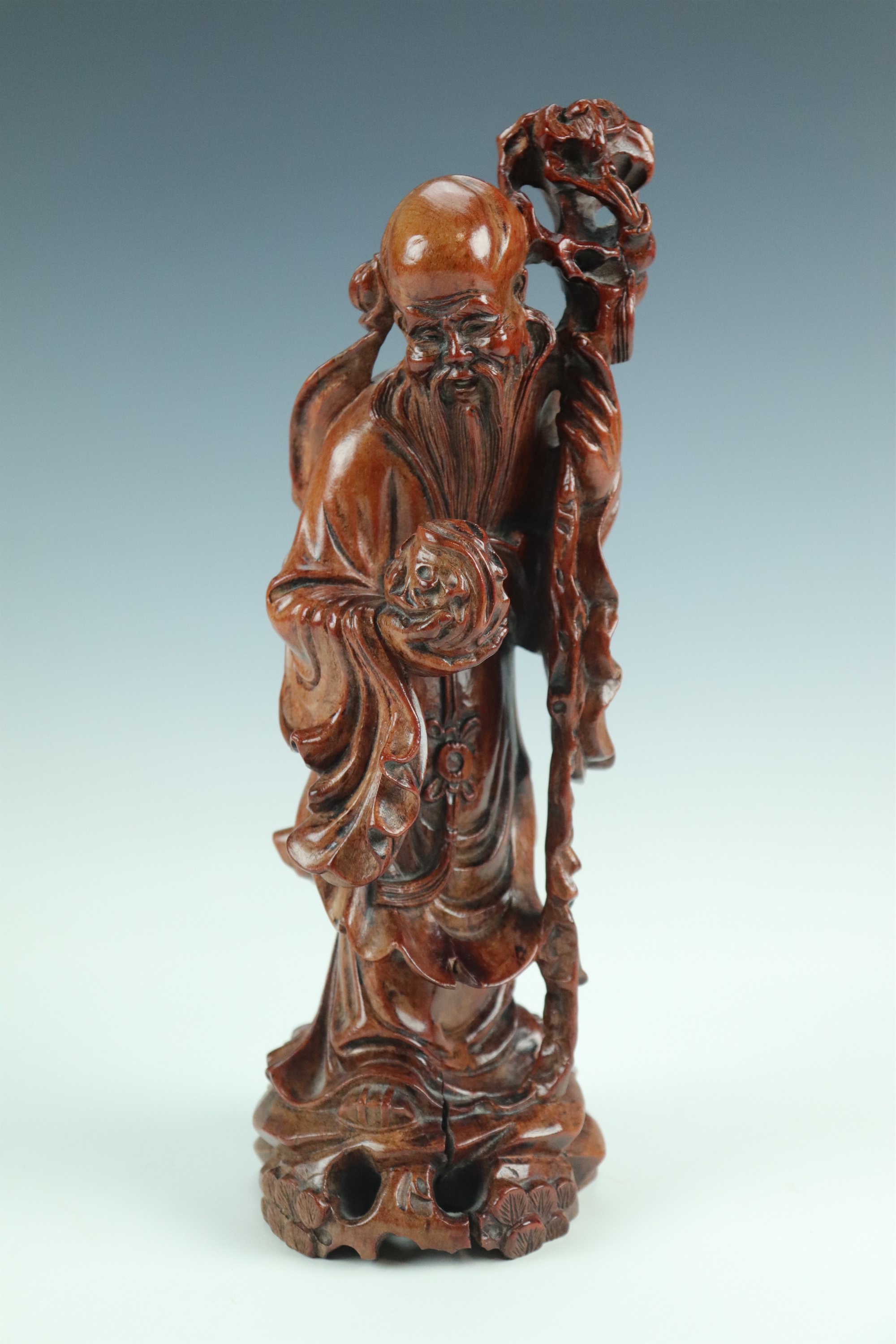 A late 20th Century Chinese carved wood figure of an Immortal, 26 cm