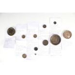 11 Queen Anne bronze trade weights, including one bearing engraved marks along with 'County of