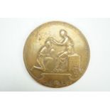 A bronze medallion relating to the Rio de Janeiro International Exposition,1922 - 1923, reverse