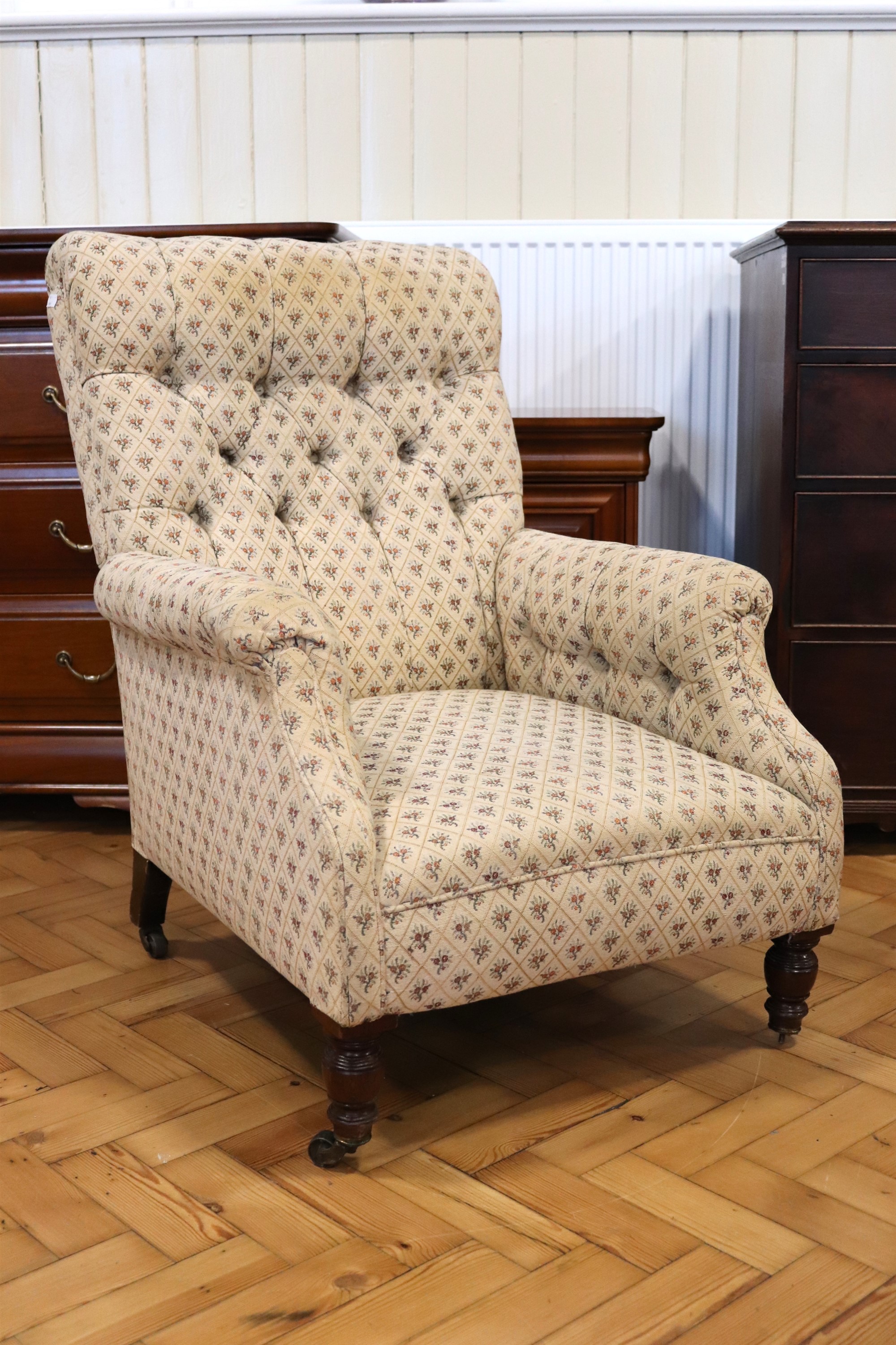 A Victorian upholstered mahogany lounge armchair