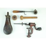 A group of Victorian gun tools and accessories including a Sykes patent powder flask, a 12-bore