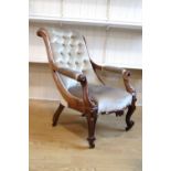 A Victorian upholstered rosewood lounge open armchair