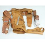 A group of vintage children's toy Wild West cowboy pistol belts and holsters including Mattel "