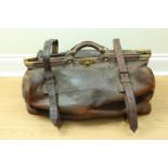 A 19th Century leather Gladstone bag, 65 cm long x 31 cm wide