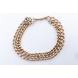 A vintage yellow metal double curb link bracelet, (tested as high carat gold), 21 cm, 41 g