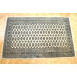 A silk blend Bokhara Persian rug, 250 x 155 cm