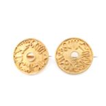 A pair of high carat yellow metal disc brooches, each bearing zodiacal symbols in cannetille, 22 mm,
