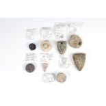 Eight Medieval lead trade weights, of various forms including shield shaped bearing three lions,
