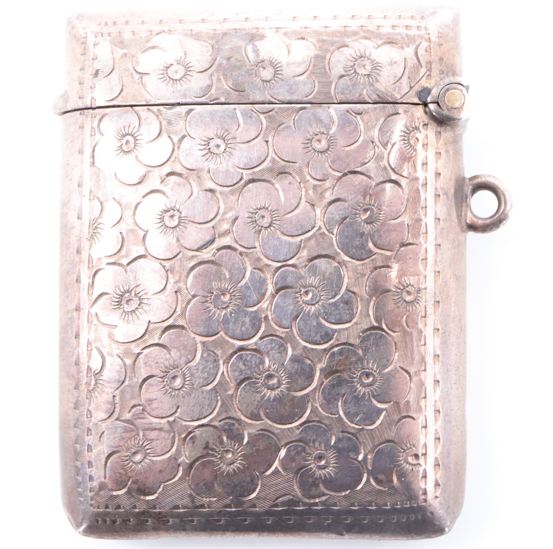 An early George V silver fob vesta case, of cushion form and decorated with engraved flowerheads - Image 2 of 4