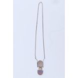 A modernist opal and white metal necklace, comprising a 15 x 11 mm opal cabochon bezel set above a D