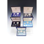 Two boxed 1974 "Coinage of Belize" silver proof coins sets, together with three boxed 1973 British
