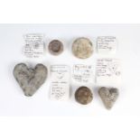 Five Medieval lead trade weights, comprising two heart shaped, a bun bearing 'WD' within a circle of