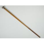 A late 19th Century Portuguese white metal topped malacca cane, the oblate handle bearing an