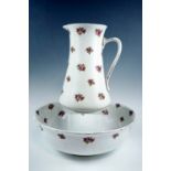 An early 20th Century Bridgwood floral pattern wash basin and jug, latter 31 cm