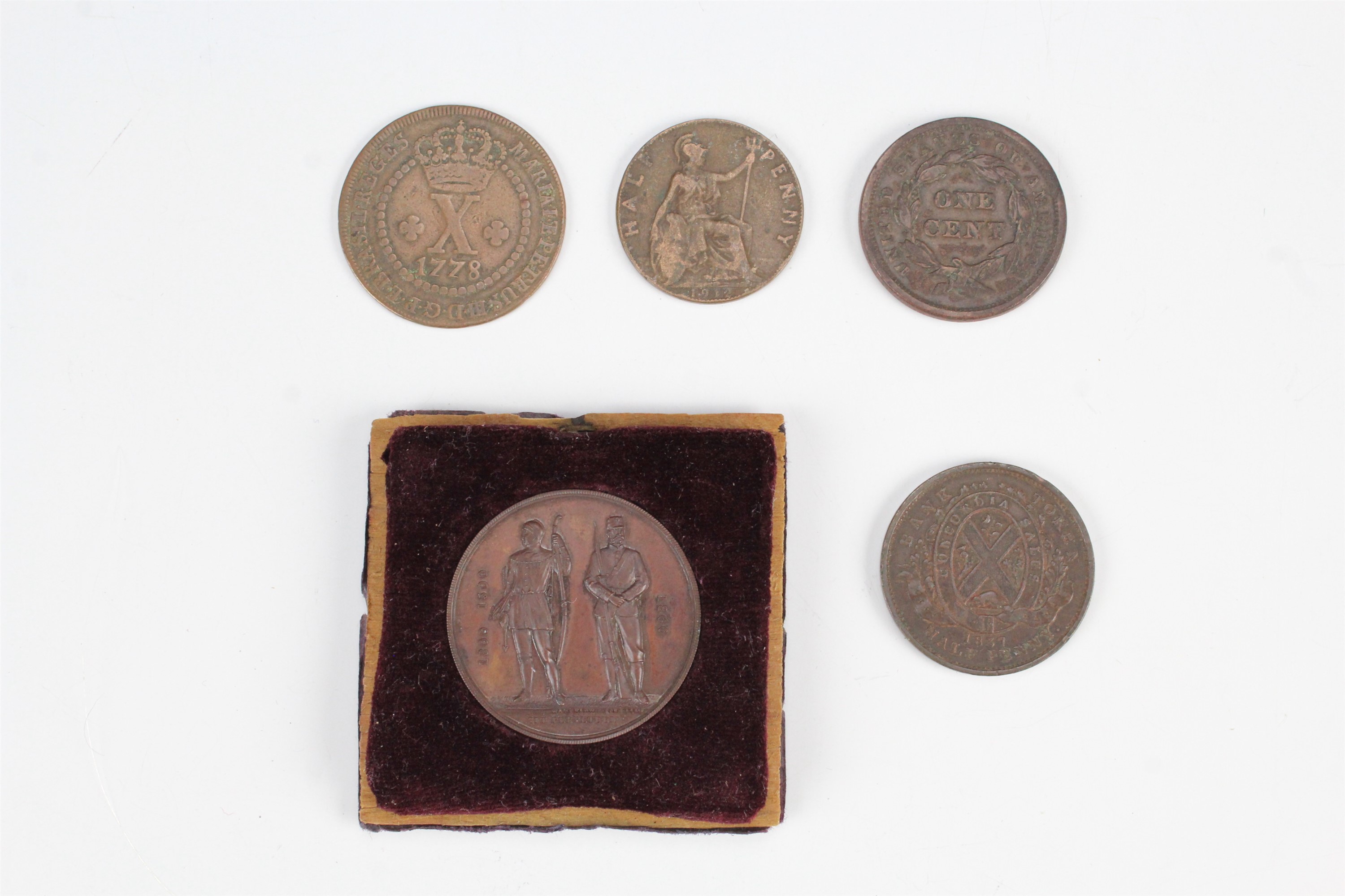 A group of coins, comprising a 1778 low crown 10 Reis, an 1842 "Liberty Head" Cent, and a 1912 first