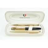 A cased Sheaffer 770 cartridge fountain pen, having 14 K nib, and two Sheaffer ball point pens