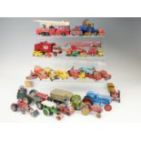 A group of vintage play-worn diecast tractors, cranes and other work vehicles, including Corgi,