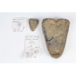 Two Medieval shield shaped lead trade weights, bearing fleur-de-lys, 4 cm, 52 g and 12 cm, 980 g