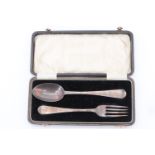 A Victorian cased silver christening set, comprising a Hanoverian pattern spoon and a fork profusely