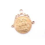 A 1912 sovereign pendant, having adorsed yellow metal scrolls [tested as high carat gold] and