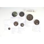 Seven James II bronze trade weights, including bearing marks for Hampshire / Southampton, and '