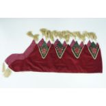 A vintage velvet Christmas mantle decoration adorned with sequin Christmas trees and tassels, 170 cm