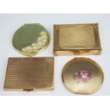 A vintage Stratton powder compact, together with a Carene musical compact, another compact and a