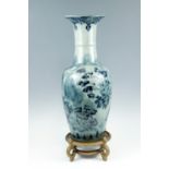 A modern Chinese long necked blue and white vase, of shouldered ovoid form with everted rim,