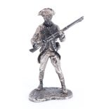 A miniature silver figurine of an 18th Century infantryman, London, 1975, 46 g, 58 mm