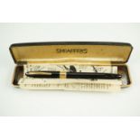 A 1950s cased Sheaffer Snorkel 'Statesman' fountain pen, (case a/f)