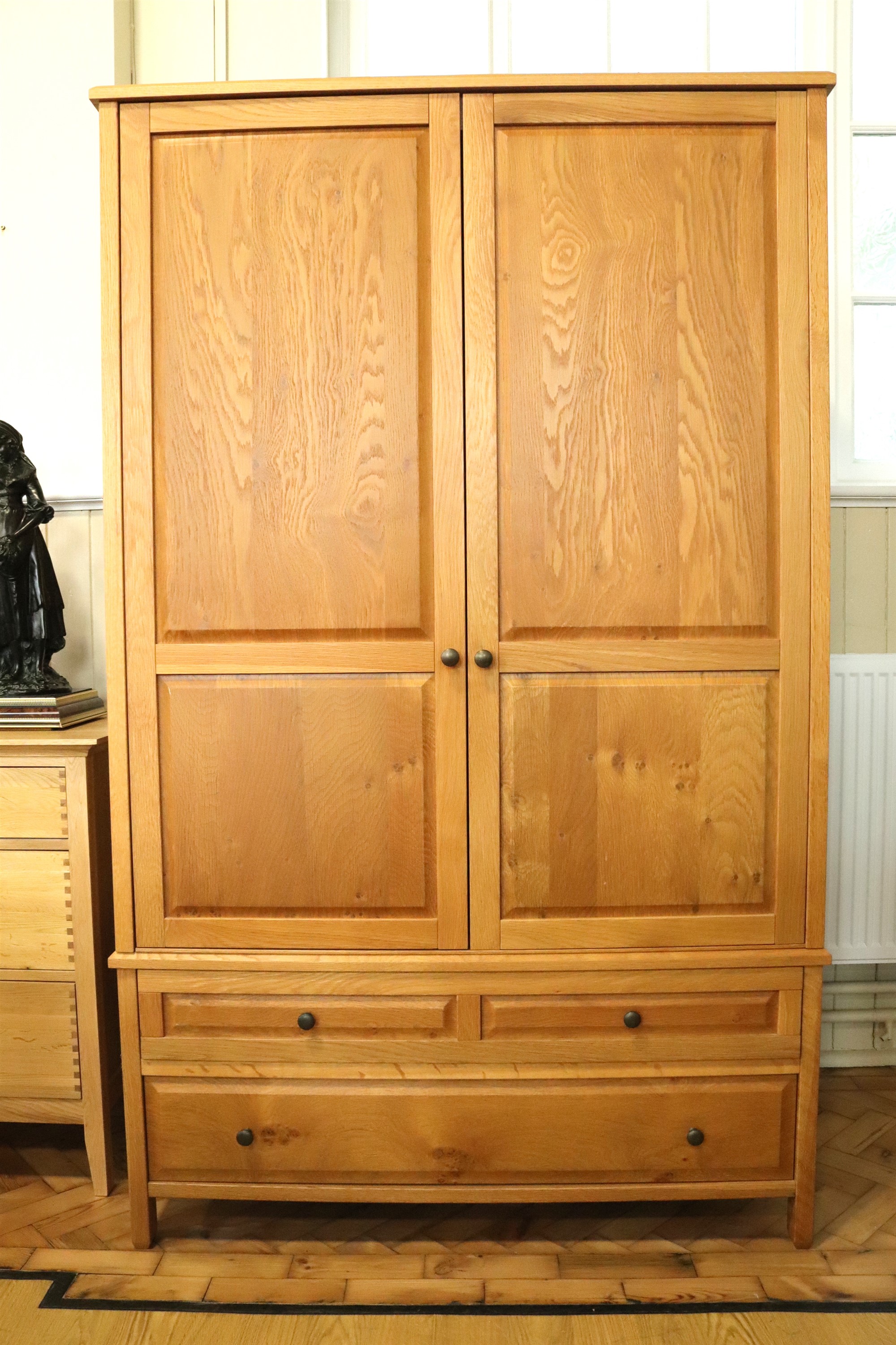 A contemporary blonde oak wardrobe, 62 cm x 120 cm x 196 cm