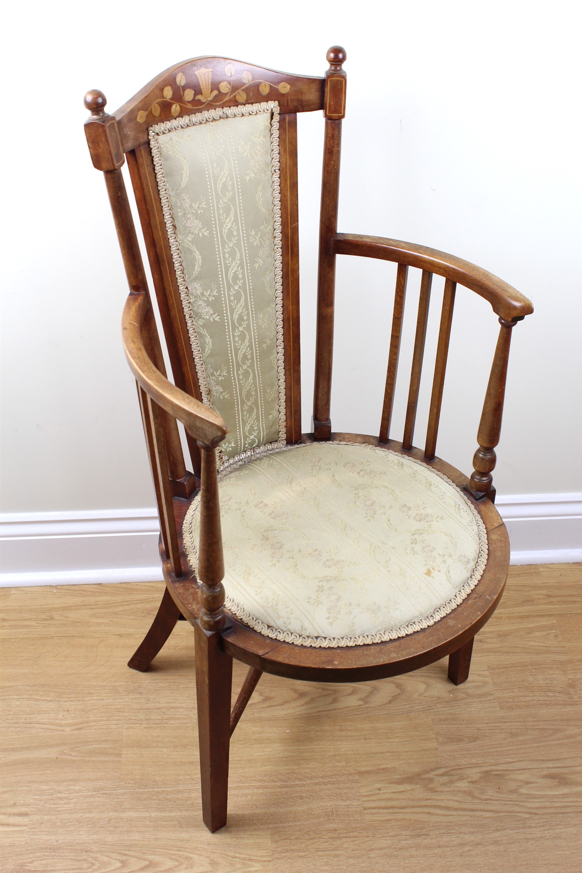 An early 20th Century Arts and Crafts influenced inlaid mahogany tub armchair, 50 cm x 99 cm