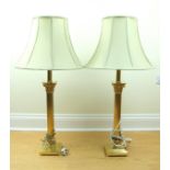 A pair of tall brass columnar table lamps with shades, 66 cm to top of sockets