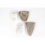 Two Medieval shield shaped lead trade weights, bearing a cross / saltire, and a crowned monarch's
