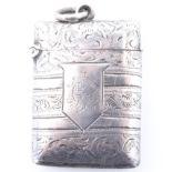A late Victorian silver fob vesta case, of cushion form bearing banded foliate scroll engraved