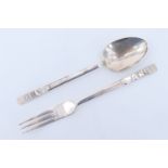 A 1930s Christening fork and spoon, the cast handles bearing the name 'Ann', London, 1935 / 1938, 60