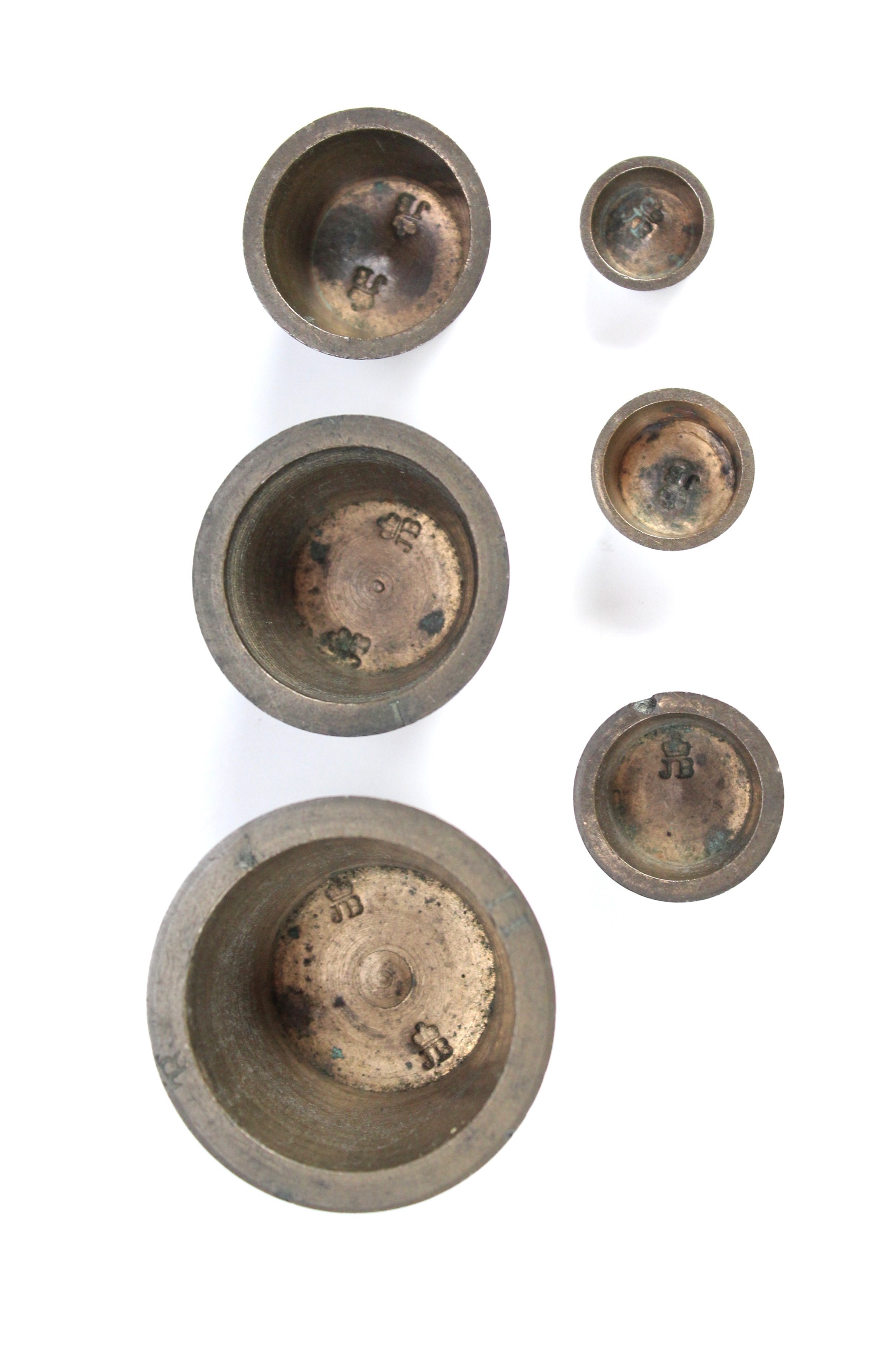 A near set of 19th Century bronze nesting weights, comprising house and six cup weights (lacking - Image 2 of 3