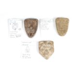 Three Medieval shield shaped lead trade weights, bearing fleur-de-lys, and fleur-de-lys surmounted