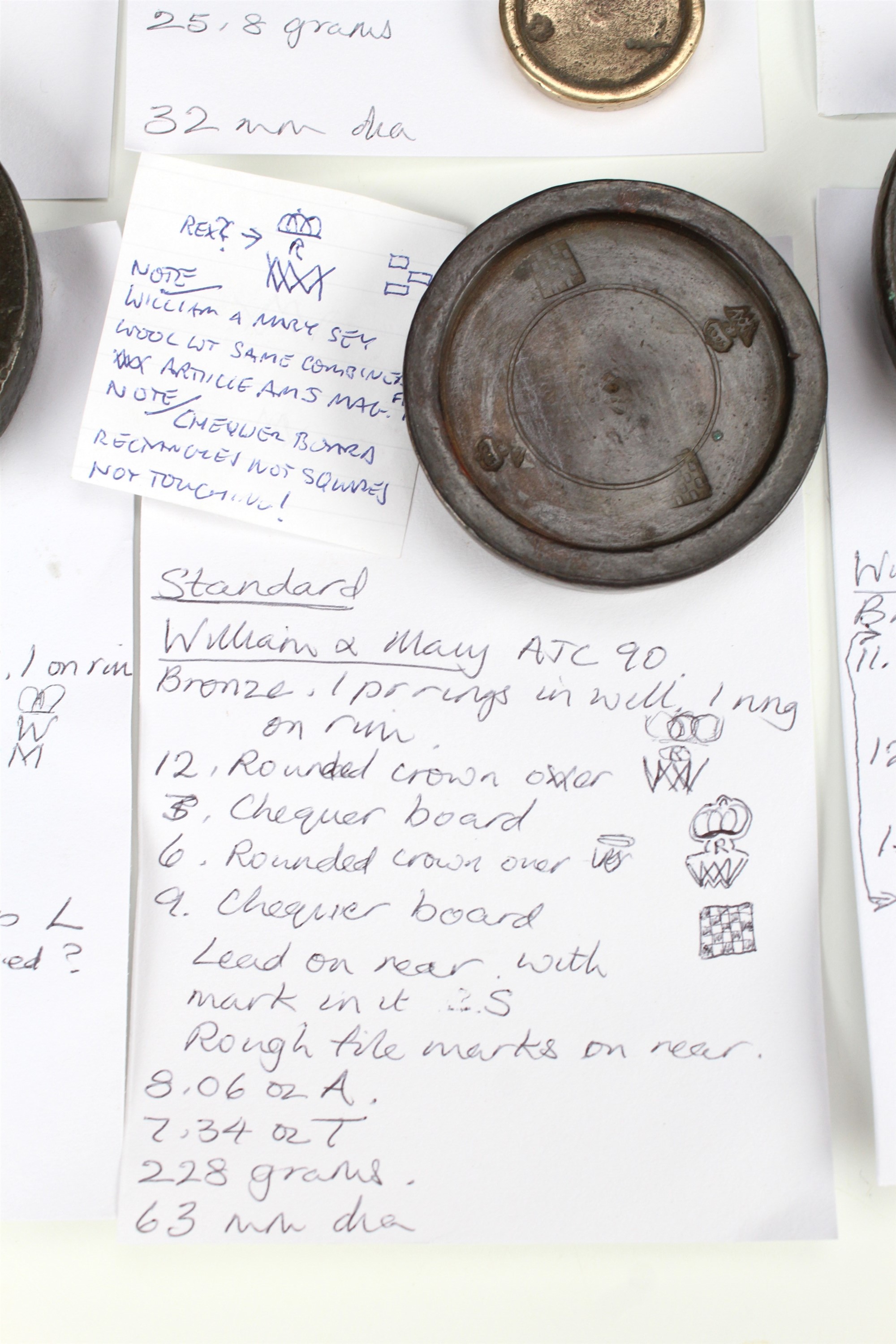 14 William and Mary bronze trade weights, including marks for 'Gloucester Co', and a chequerboard - Image 3 of 7