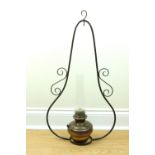 A 20th Century brass and wrought iron hanging oil / harp lamp, 86 cm