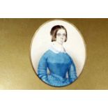 An early Victorian portrait miniature of a lady in blue, card mounted in frame under glass, 30 cm